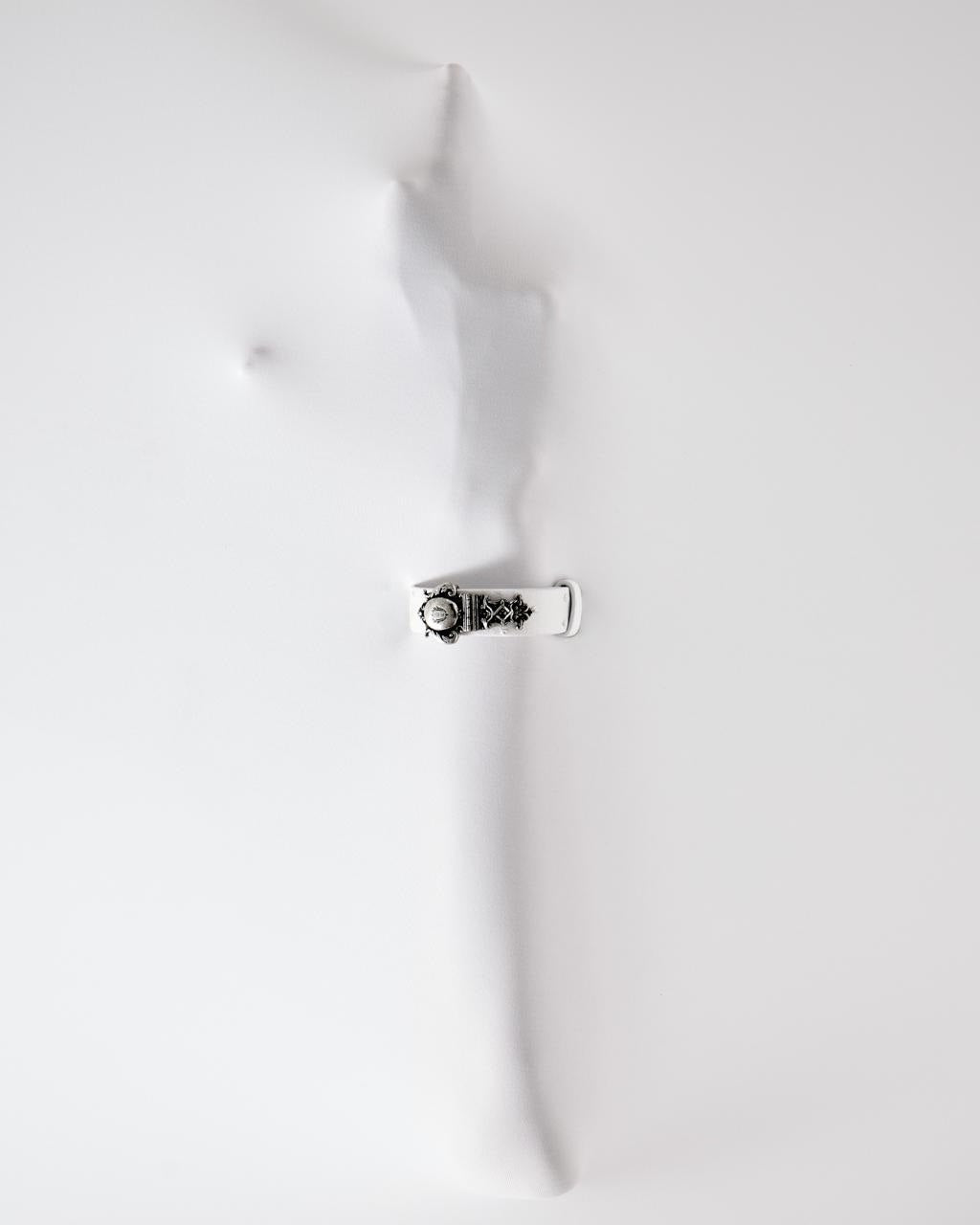 Château jewelry on a white sculpted arm